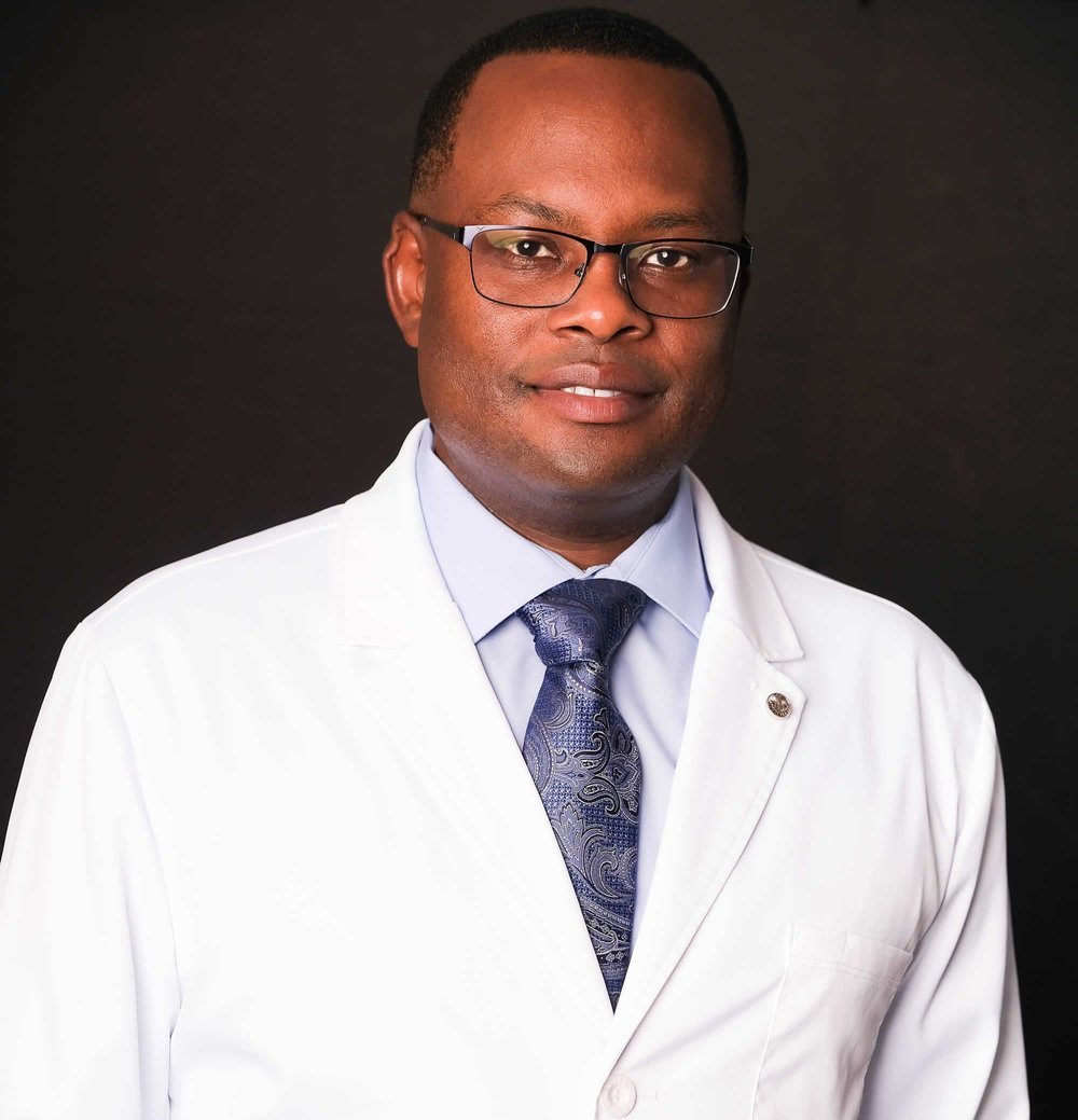 Ayub Mwaura in a white coat
